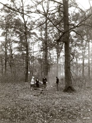 A family enjoys a picnic along Sand Run Parkway, 1934