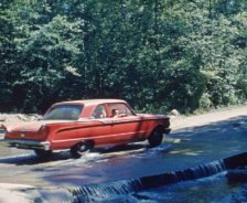 A vehicle crosses the ford on Sand Run Parkway, 1963