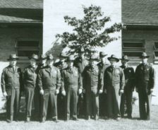 Rangers pose in front of Goodyear Lodge, once the park district’s headquarters building, 1962