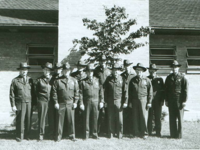 Rangers pose in front of Goodyear Lodge, once the park district’s headquarters building, 1962
