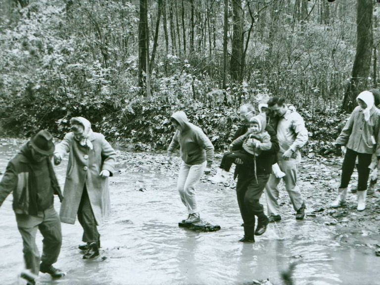 Hikers cross a stream during the spree, 1965