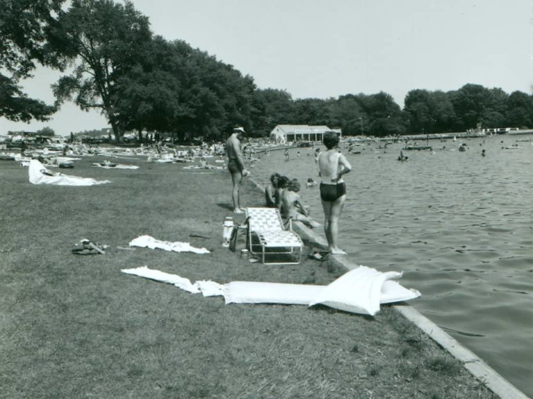 Sunbathers enjoy Munroe Falls swim lake, 1979
